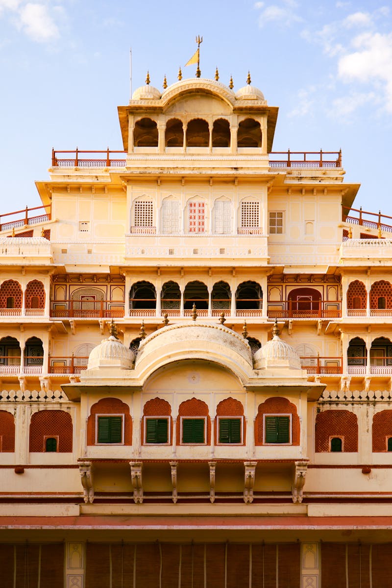 The stunning facade of the Chandra Mahal in Jaipur, showcasing Mughal architecture.