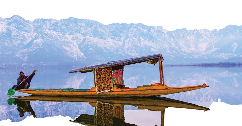 A vibrant shikara on Dal Lake with the stunning Himalayan backdrop, perfect for travel exploration.